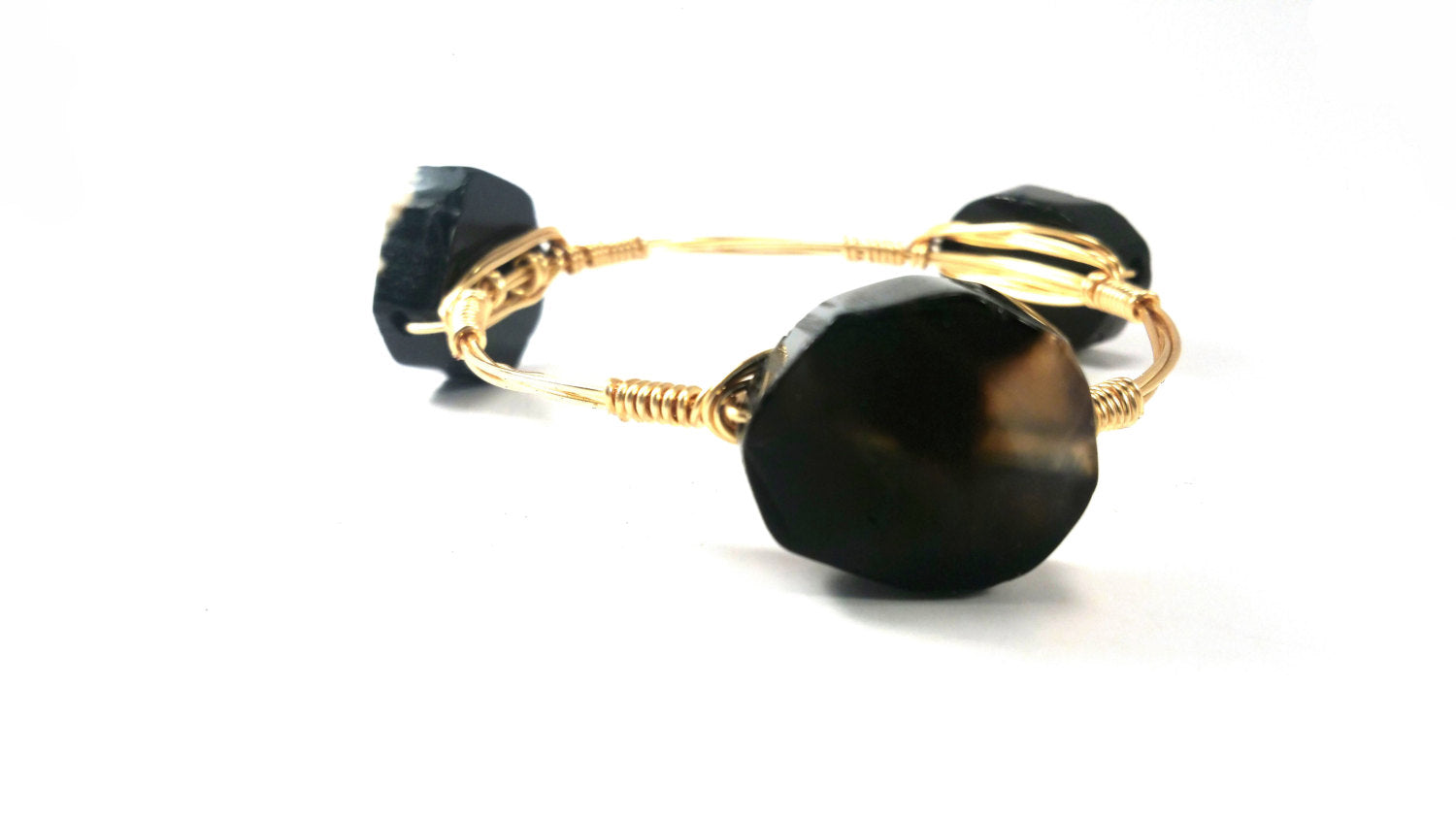 Deer antler bracelet, arrowhead bangle, and black agate slabs set